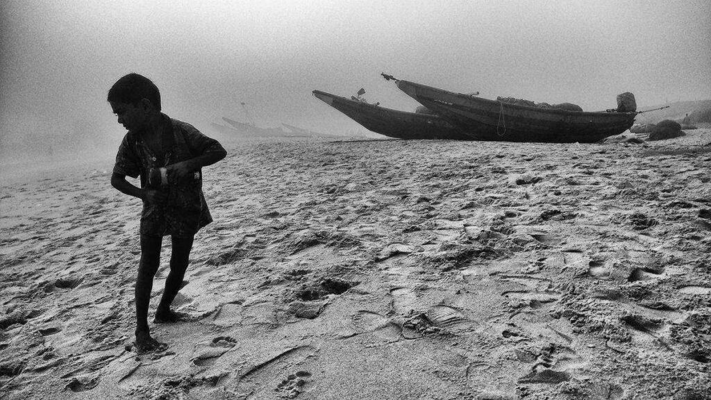 Essence of Photography: Stories in Black and White 1 The boy on the beach by Manas Arvind
Photography